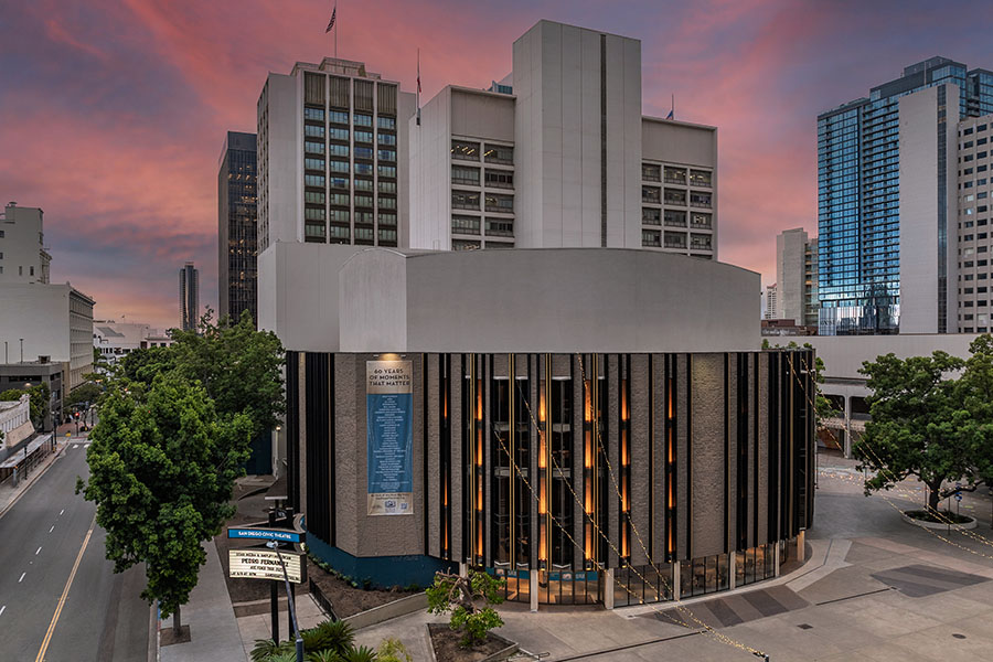 Civic Theatre facade at dusk with city skyline