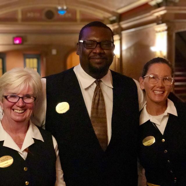 Ushers smiling in Balboa lobby