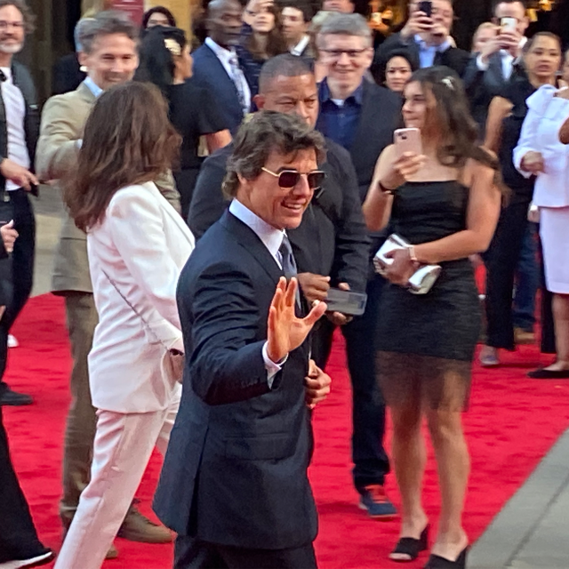 Tom Cruise waves at fans before entering the theatre Tom Cruise walks the Top Gun: Maverick red carpet at Civic Theatre