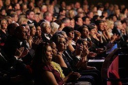Photo of an audience at the San Diego Civic Theatre watching a performance.